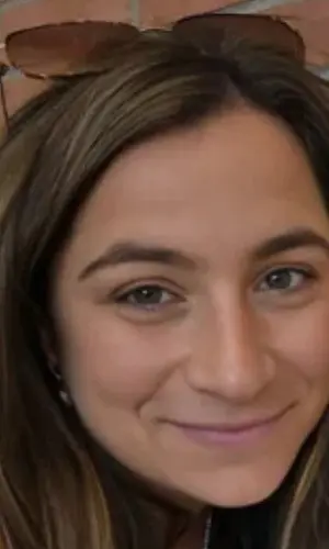 A close up of a person smiling for the camera