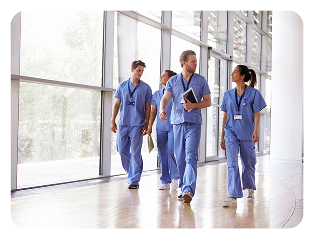 A group of doctors walking down the hallway.