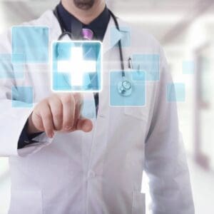 A doctor is holding an image of a cross.