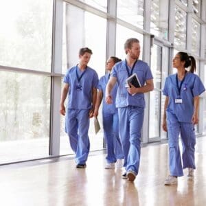 A group of doctors walking in the hallway.